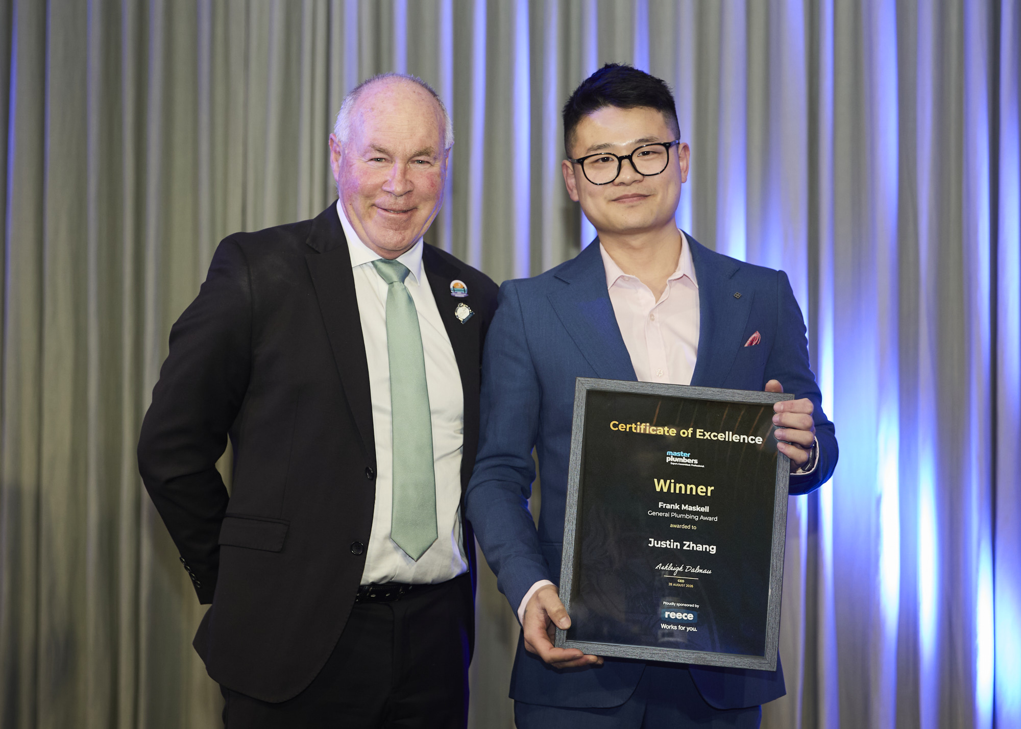 Justin Zhang receiving the Frank Maskell General Plumbing Award at the 2026 Master Plumbers Excellence Awards